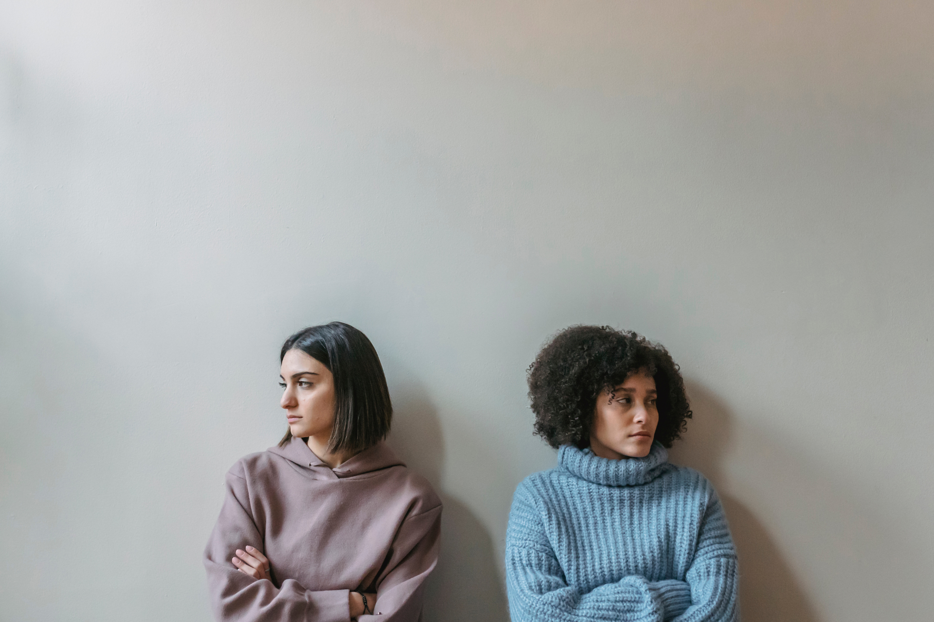 Two angry women upset after a fight due to intermittent explosive disorder.