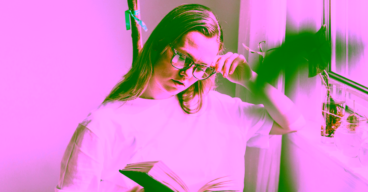 A woman reading debating between DBT and CBT therapy for her addiction and mental health disorders